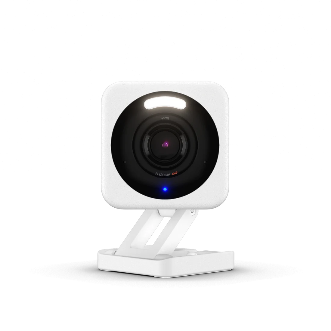 A white square security camera with a black lens on a stand.