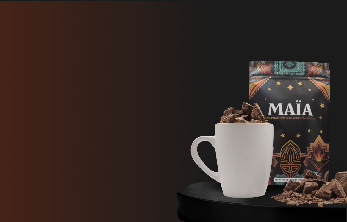White mug with chocolate chunks, next to a decorative cacao package.