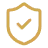 A blurry, gold-colored icon of a shield with a checkmark inside.