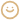 A blurry, pixelated, sepia-toned icon of a smiley face.