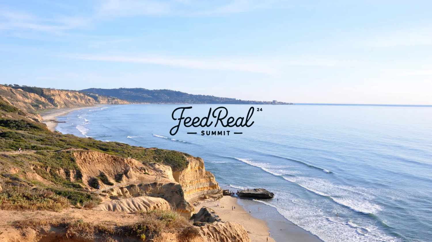 Coastal landscape with cliffs and ocean waves, 'Feed Real Summit' text overlay.
