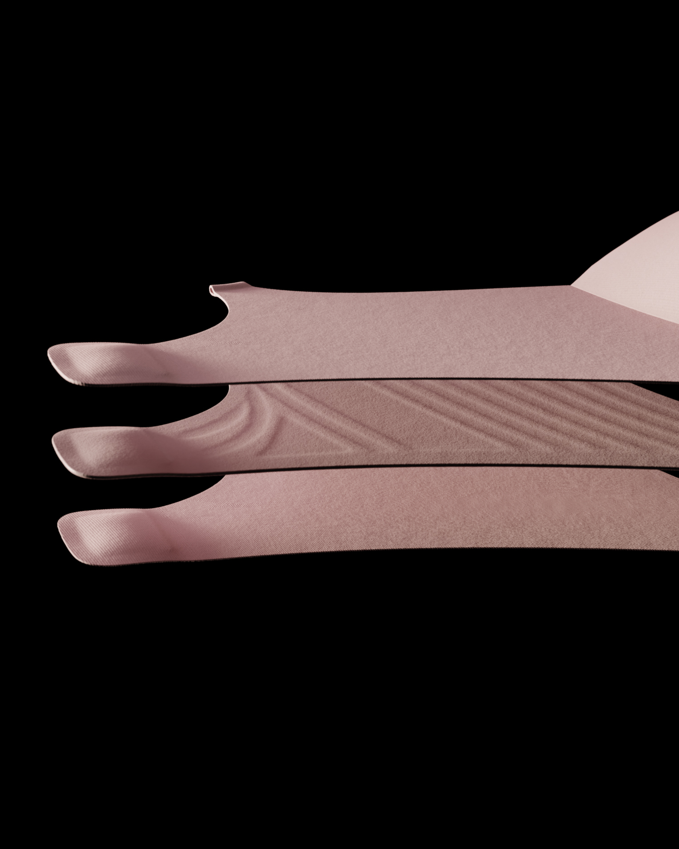 Close-up of three folded pink socks on a black background.
