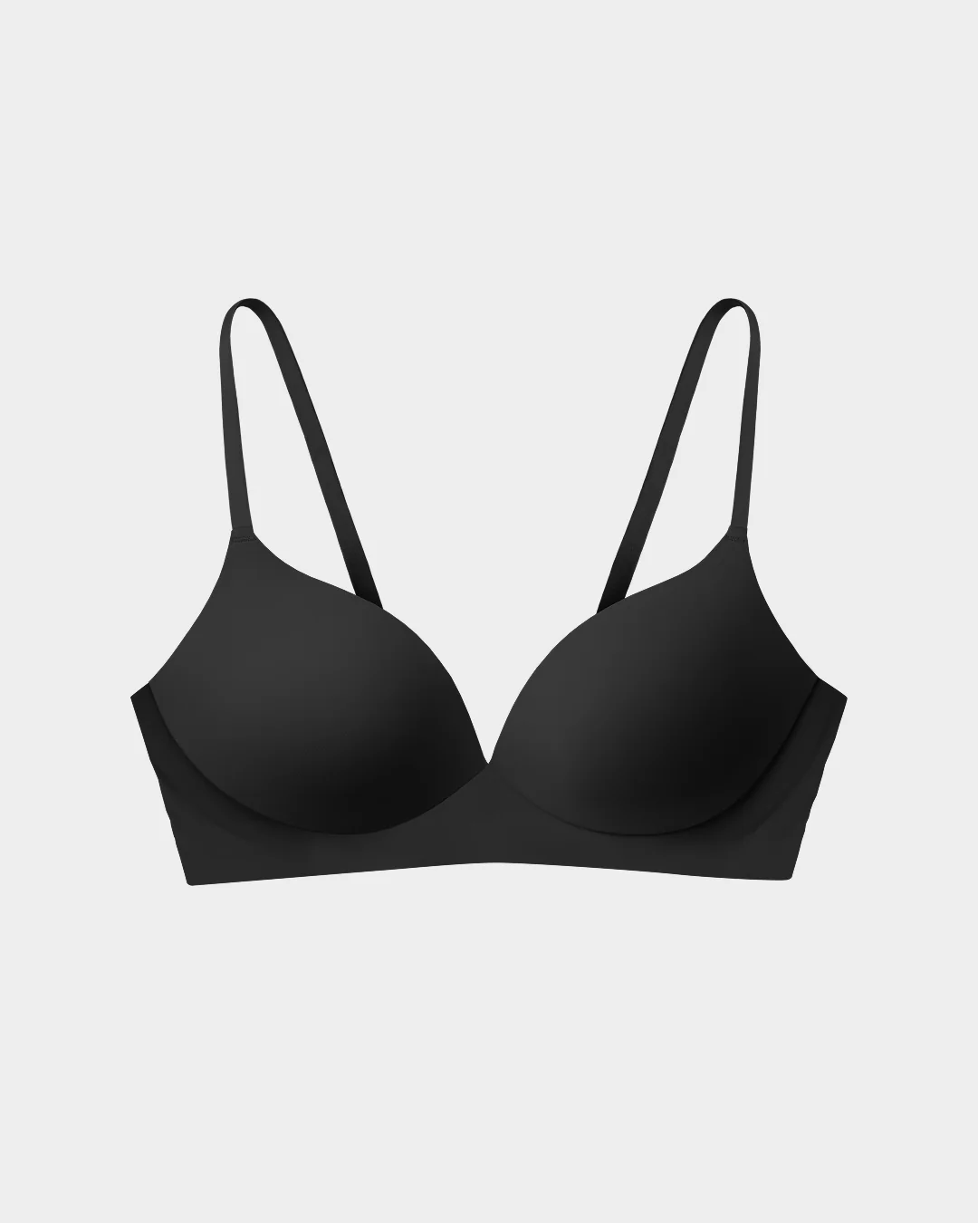 Black bra with thin straps on a white background.