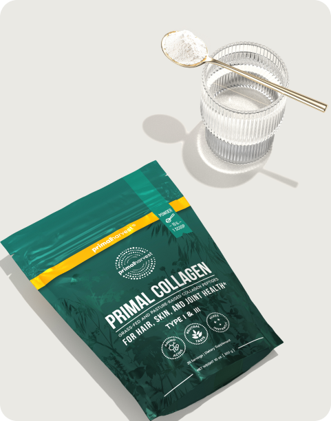Collagen supplement package and glass with spoon on a light background.
