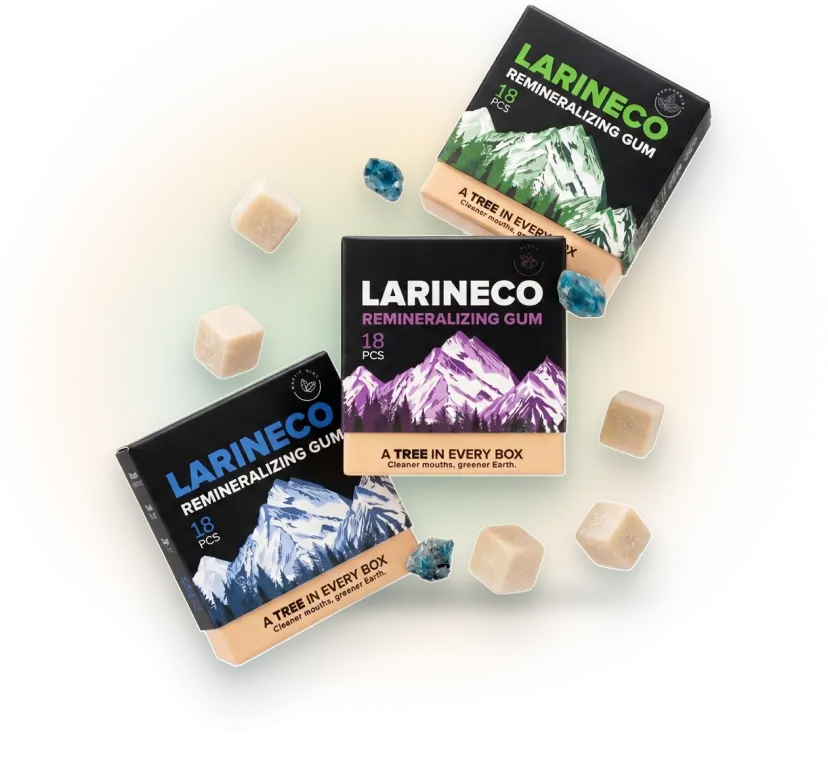 Three boxes of Larineco Remineralizing Gum are displayed with loose gum cubes and blue crystals.