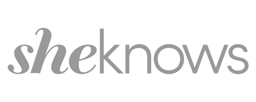 Gray text logo saying 'sheknows' on a white background.