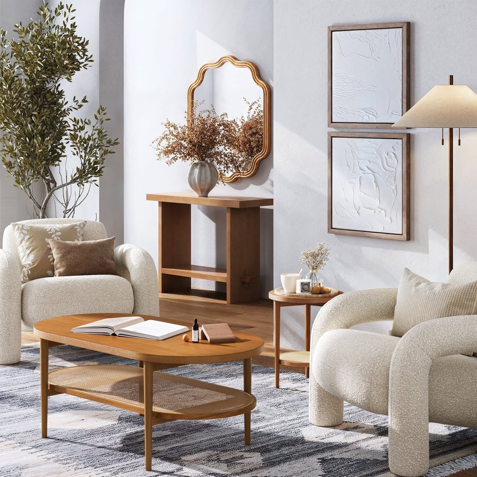 a living room with white furniture and a table