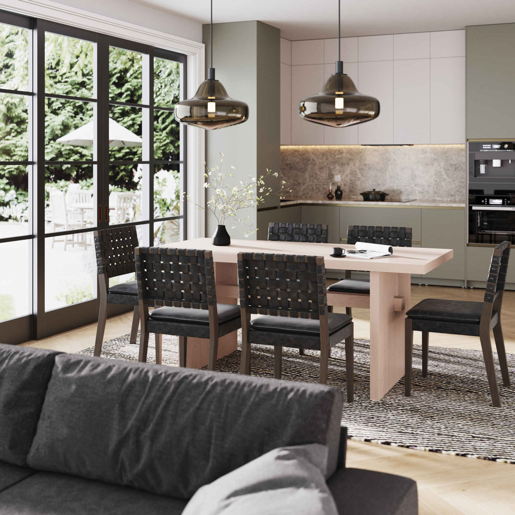 Modern kitchen with dining table, chairs, pendant lights, and large windows overlooking a garden.