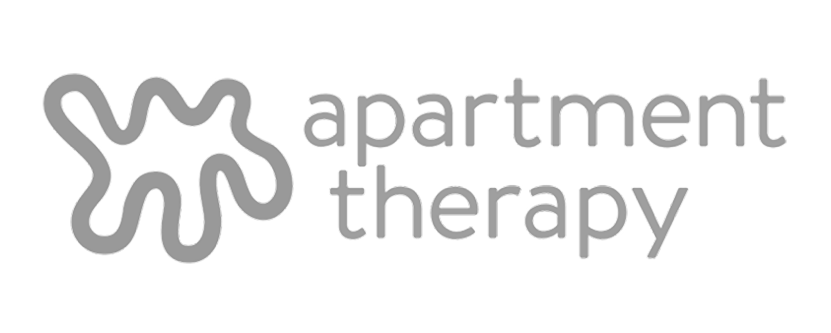 Logo with abstract shape and text 'apartment therapy'.