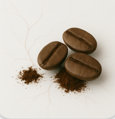 Three coffee beans with ground coffee on a light background.