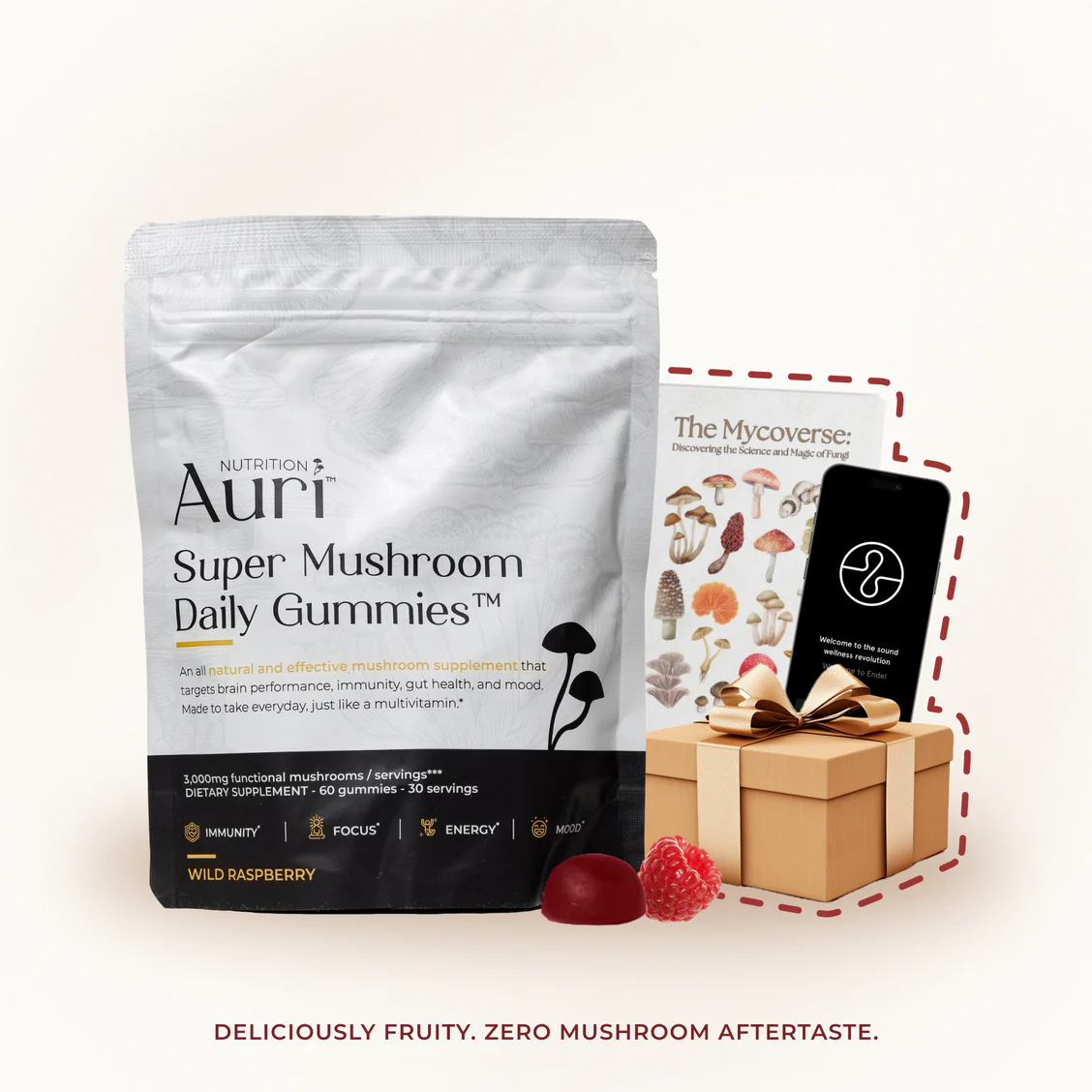 Packaging of mushroom gummies, book, smartphone, gift box, and raspberries.