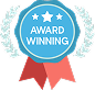Blue award badge with stars and a red ribbon.