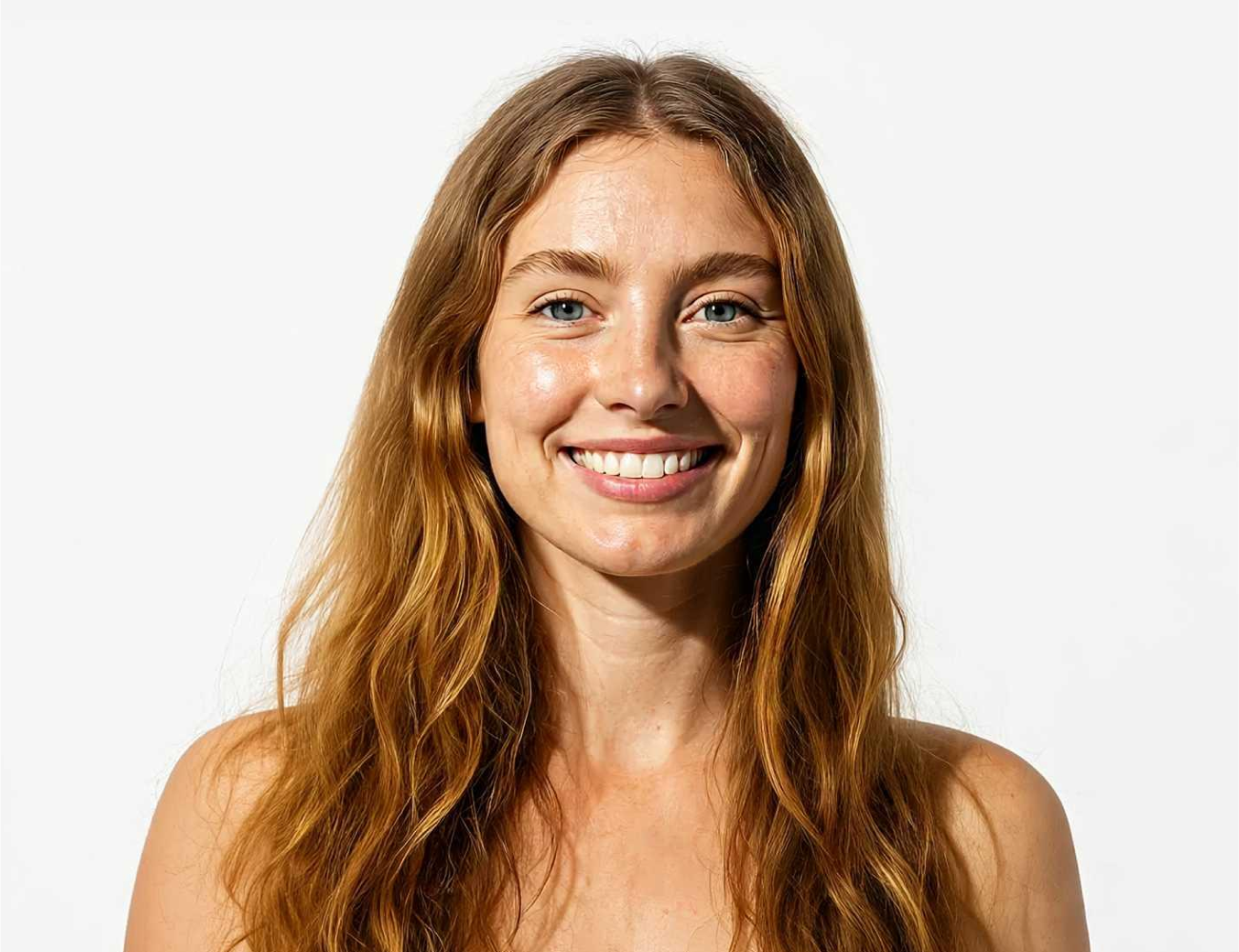 Smiling woman with long hair against a plain white background.