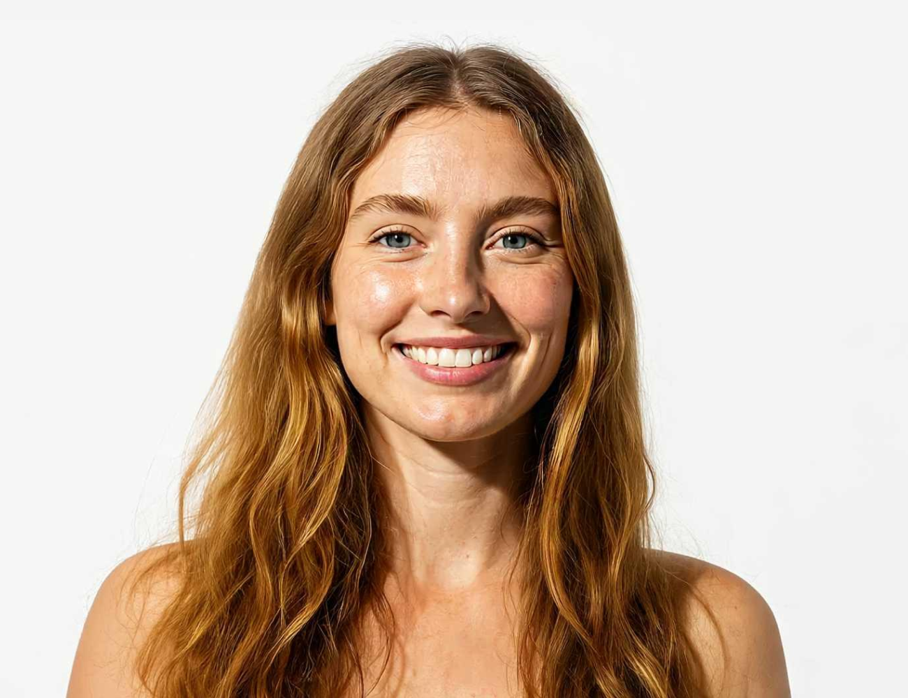 Smiling person with long hair against a plain white background.