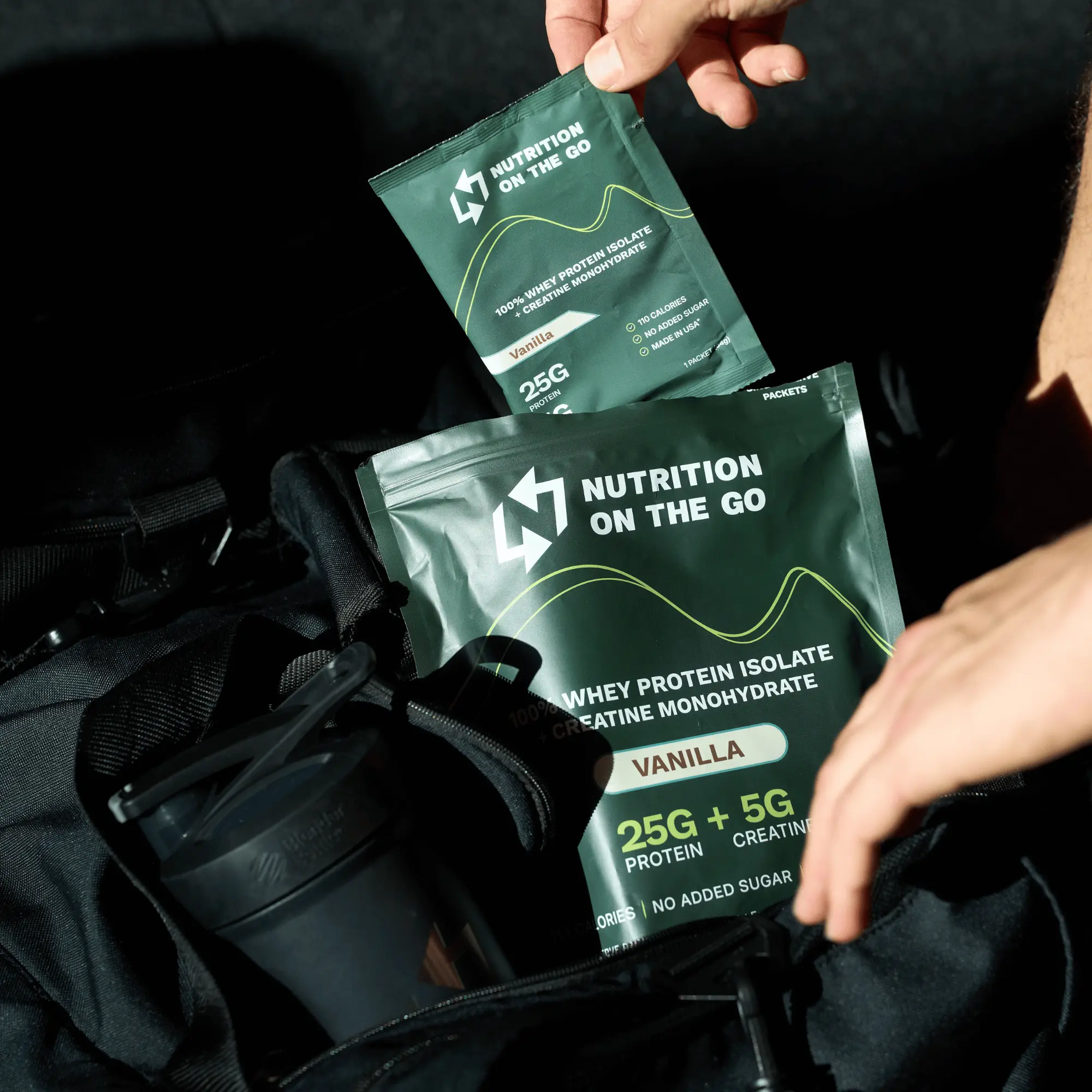 grabbing a protein packet out of the gym bag
