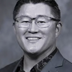 Dr. Thomas Kang, board-certified periodontist