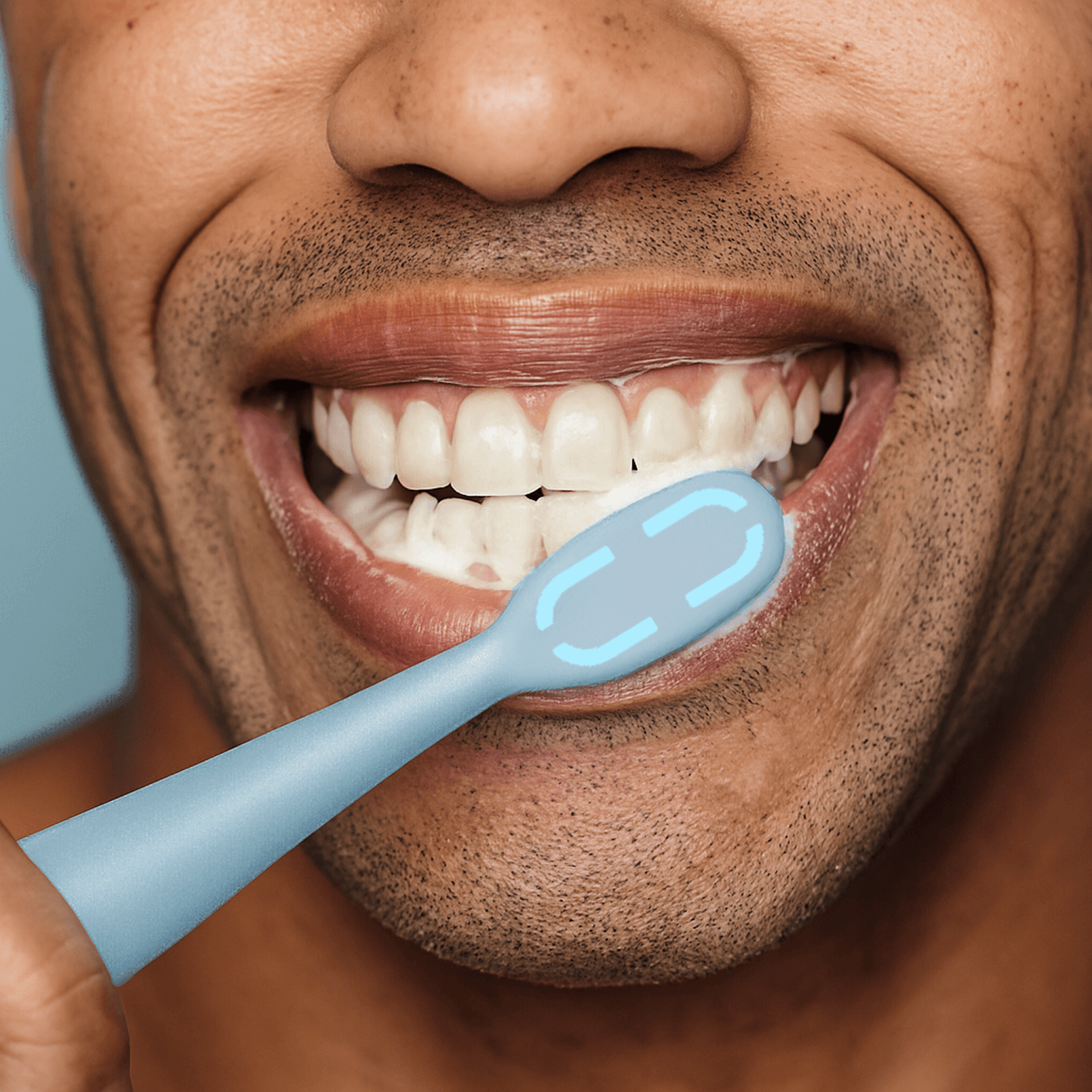 Person brushing teeth with a blue toothbrush, close-up view.