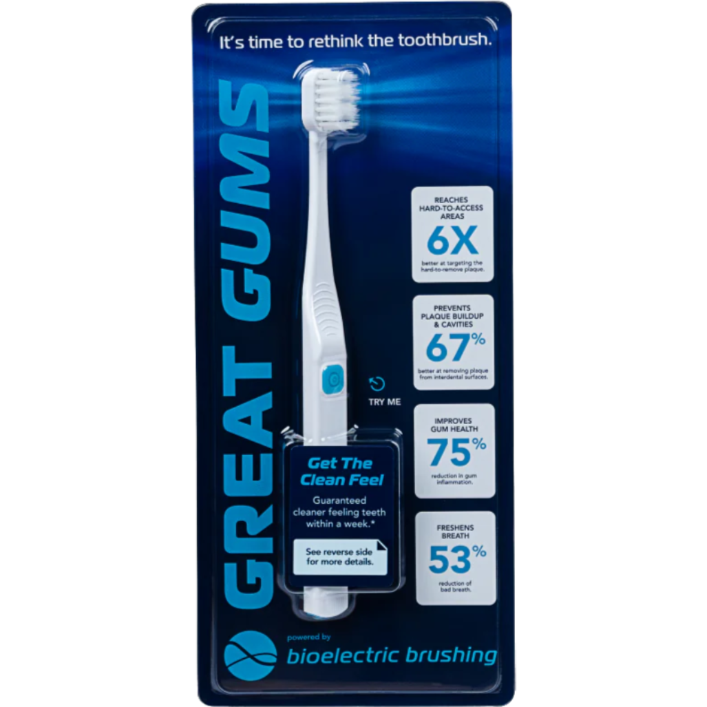 Packaging of an electric toothbrush with benefits listed on the side.