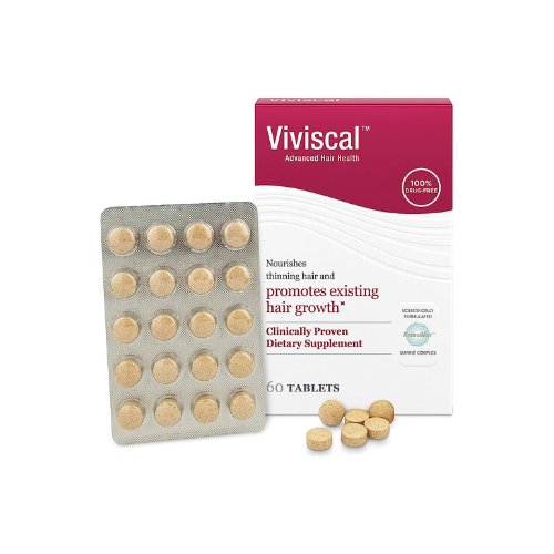 A box of Viviscal Advanced Hair Health dietary supplement next to a blister pack and loose tablets.
