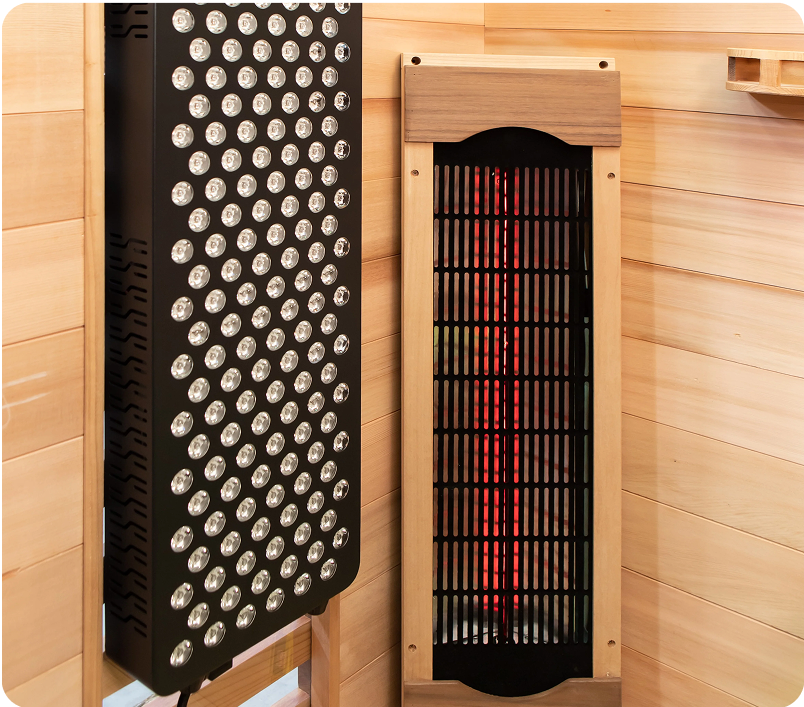 Interior of a sauna with two heating panels on wooden walls.