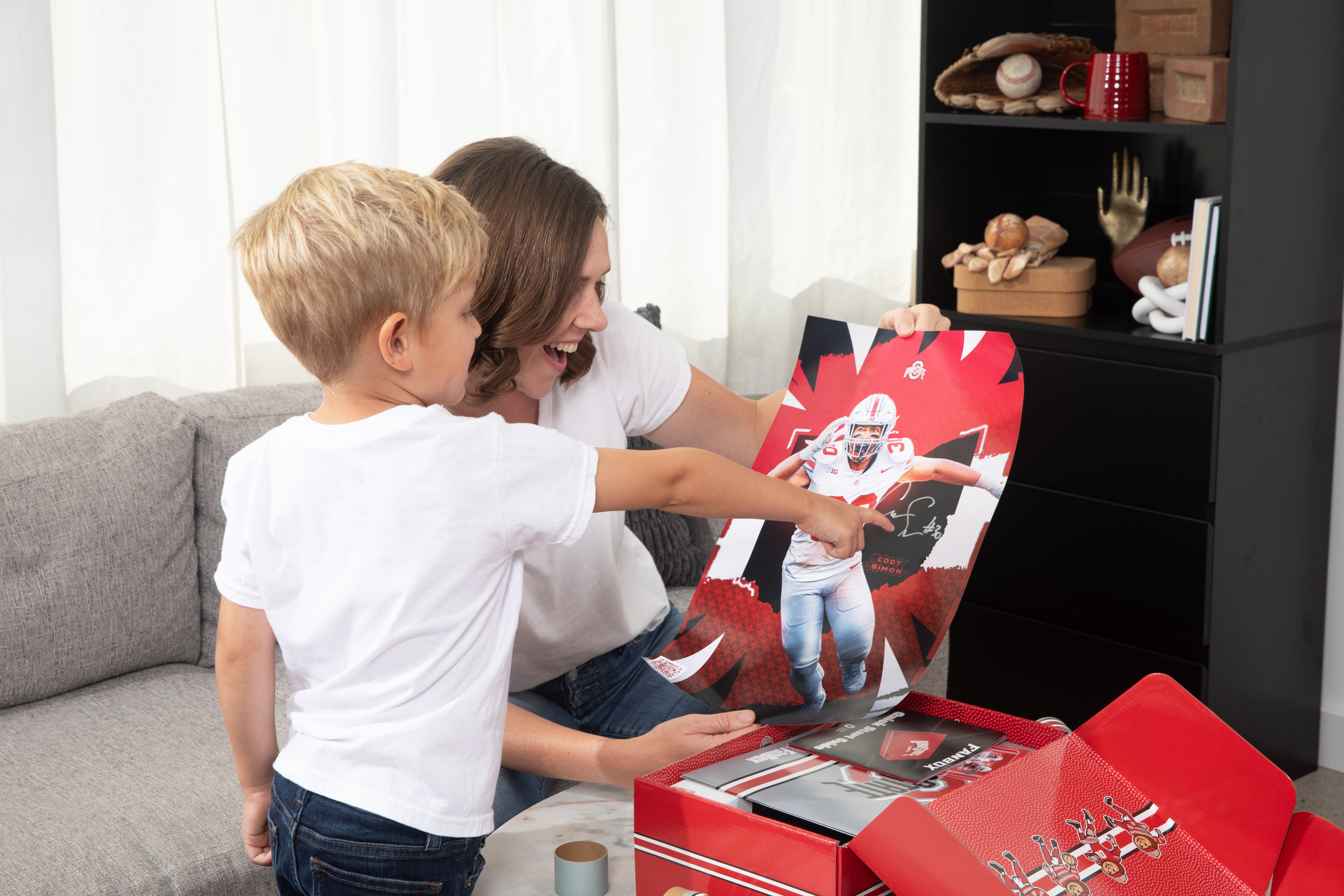 Collection of Ohio State Fanbox merchandise including posters, tickets, and game memorabilia.