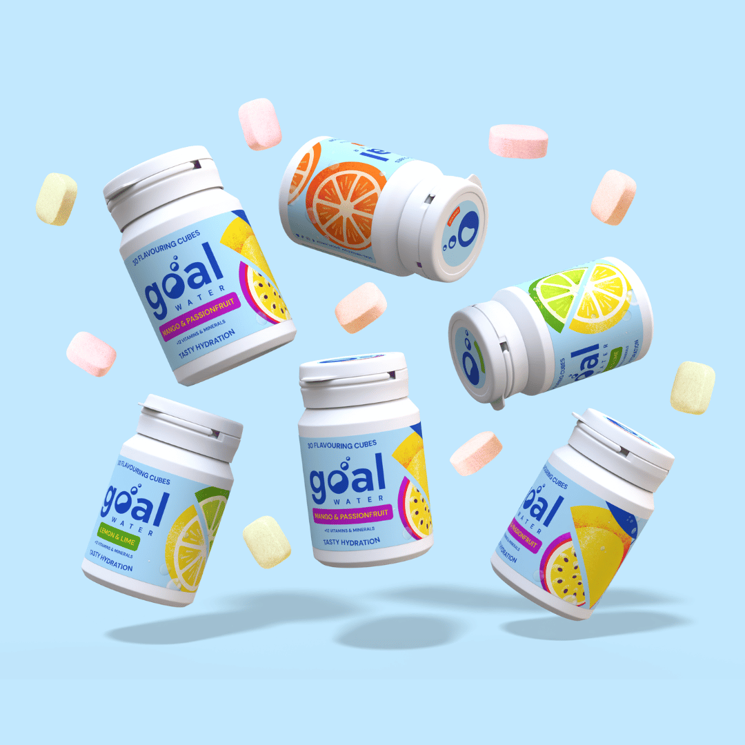 Multiple containers of Goal Water flavoring cubes in various fruit flavors floating against a light blue background.