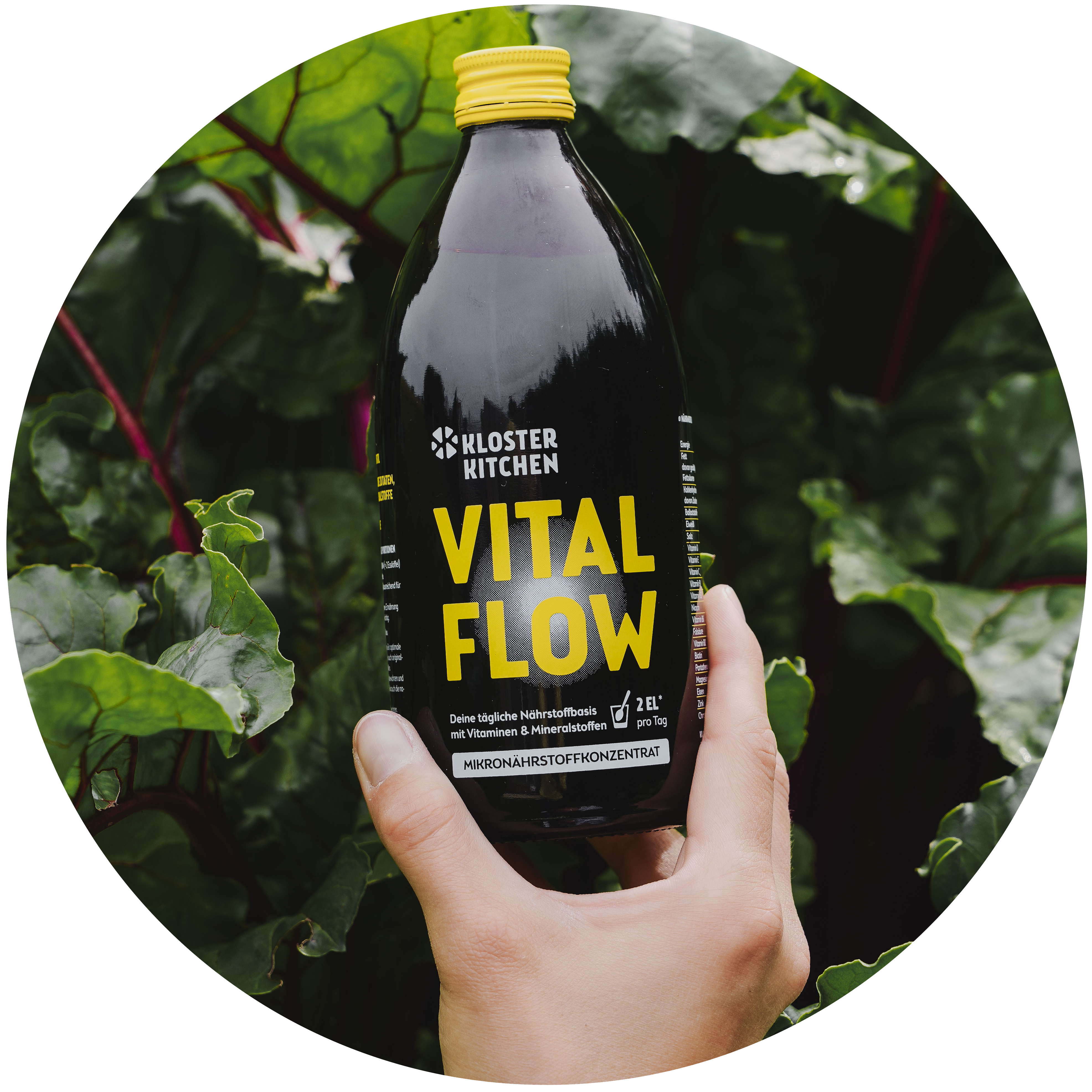 Hand holding a bottle labeled 'Vital Flow' with leafy greens in the background.