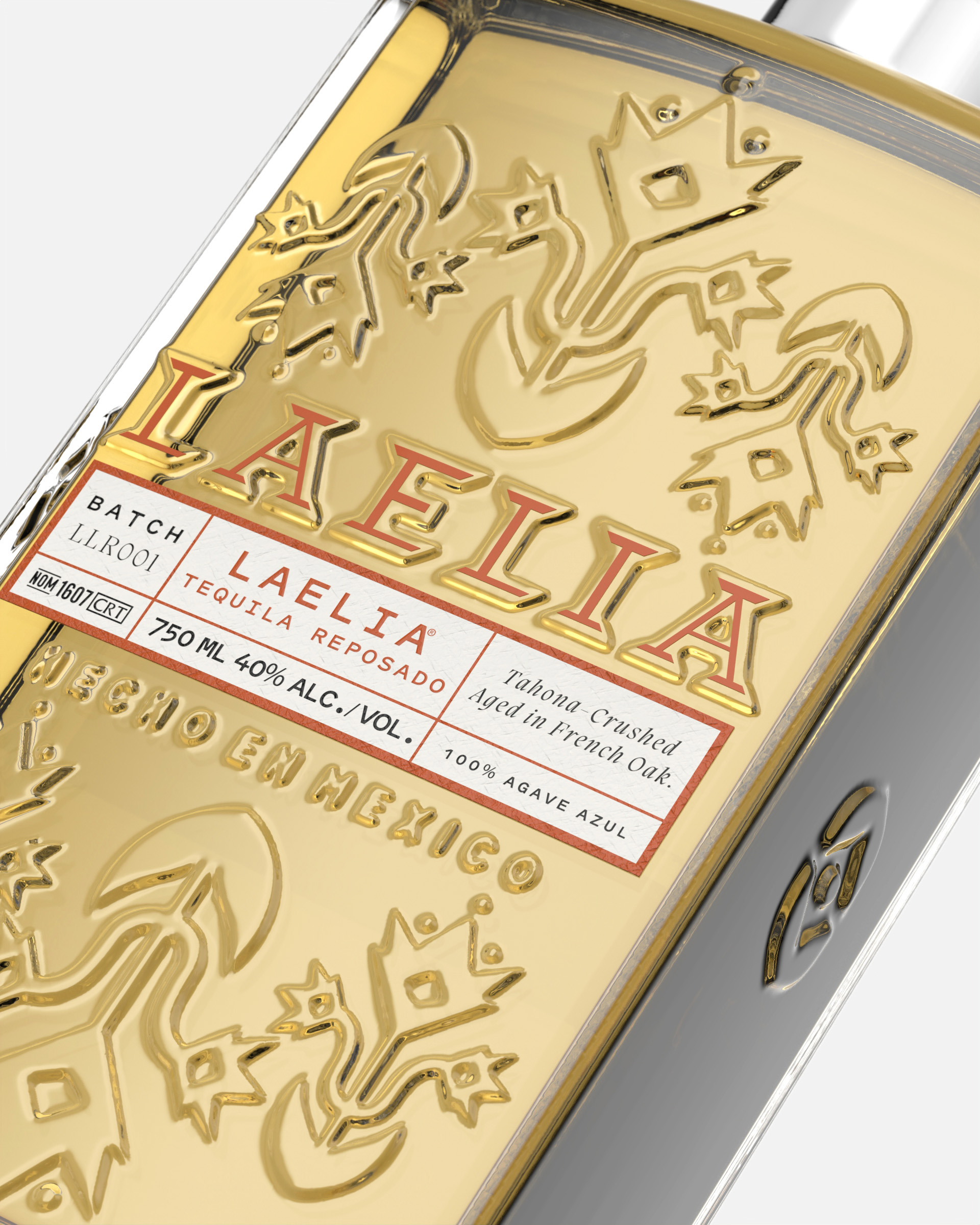 Close-up of a Laelia tequila bottle with embossed floral design.