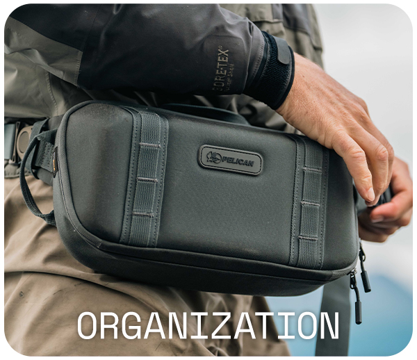 Person wearing a black waist pouch labeled 'Pelican,' with the word 'Organization' below.