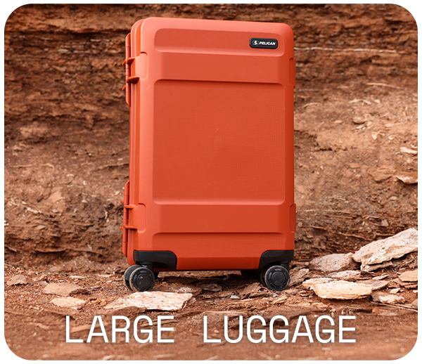 Orange rolling luggage against a rocky background.