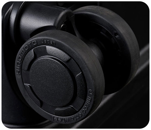 Close-up of a black plastic caster wheel labeled 'Hinomoto Japan.'