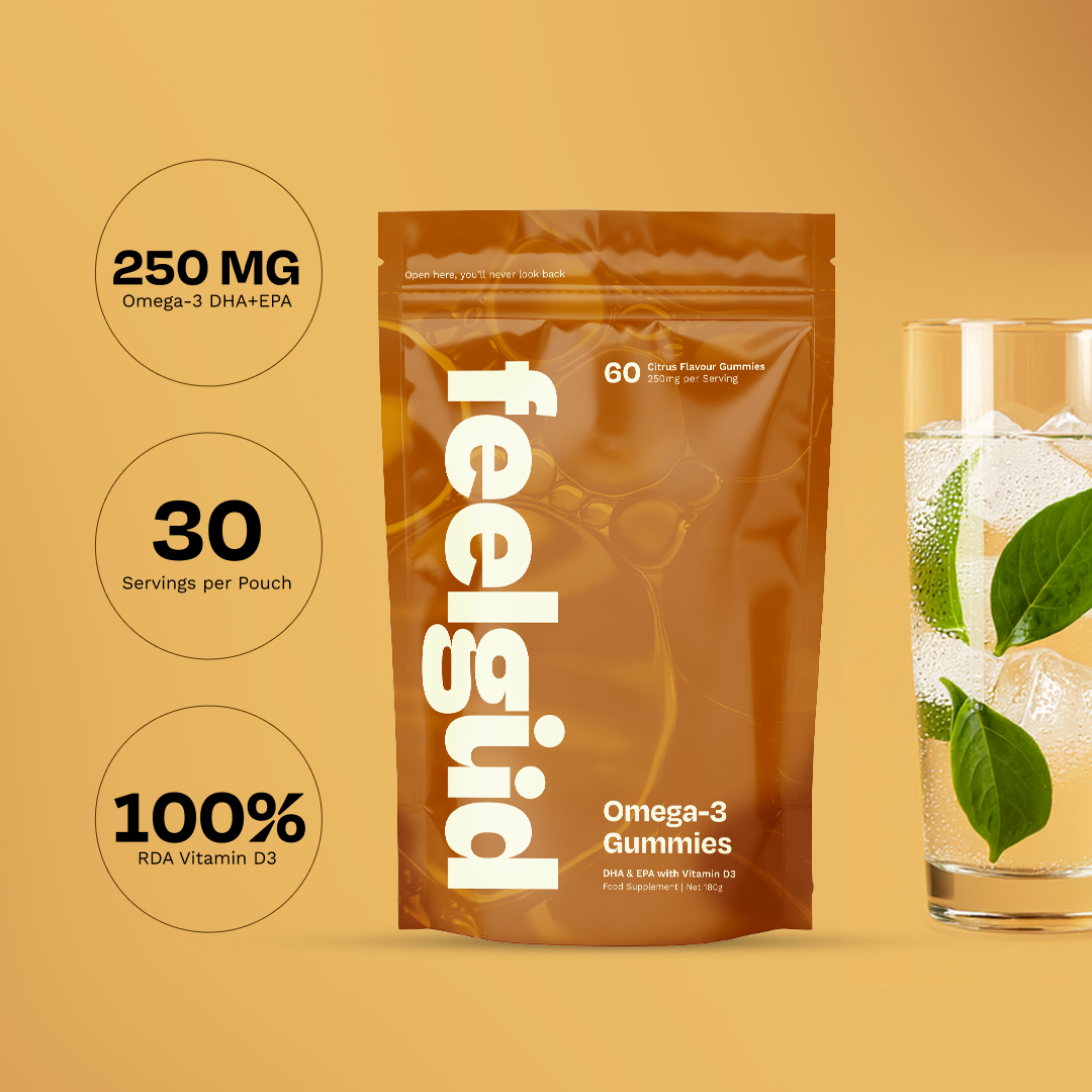 Package of Omega-3 gummies with a glass of water and mint leaves.