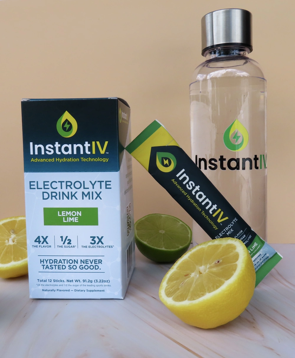 InstantIV electrolyte drink mix with lemon and lime slices.