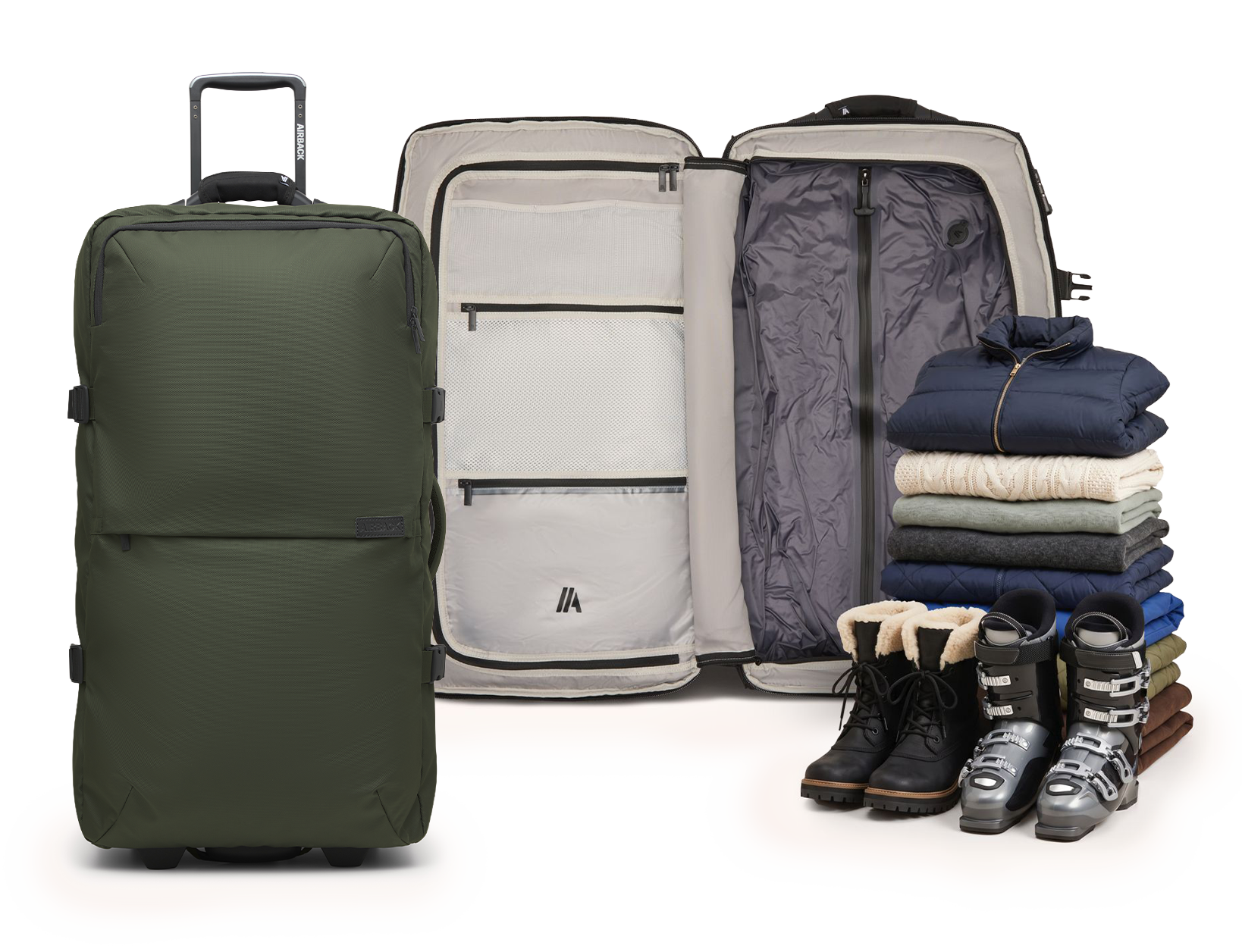 A green suitcase, both open and closed, next to a pile of winter clothing and boots.