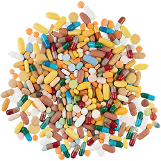 A large pile of assorted pills and capsules of many different colors and shapes on a black background.