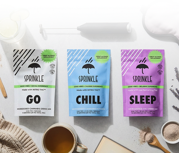 Three pouches of Sprinkle brand microdosed cannabis drink mix for Go, Chill, and Sleep on a tabletop.