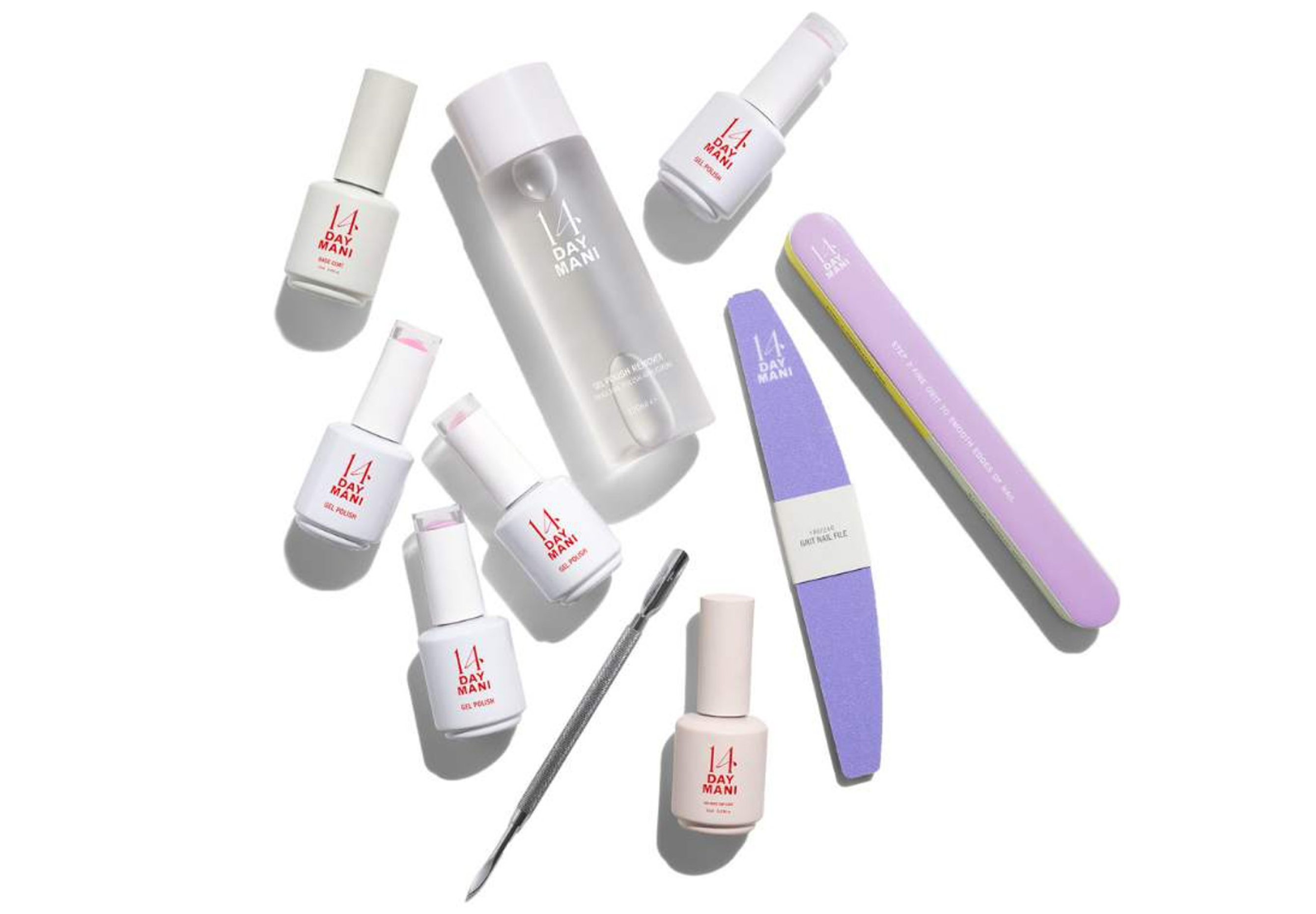Various 14 Day Mani nail products and files on a white background.