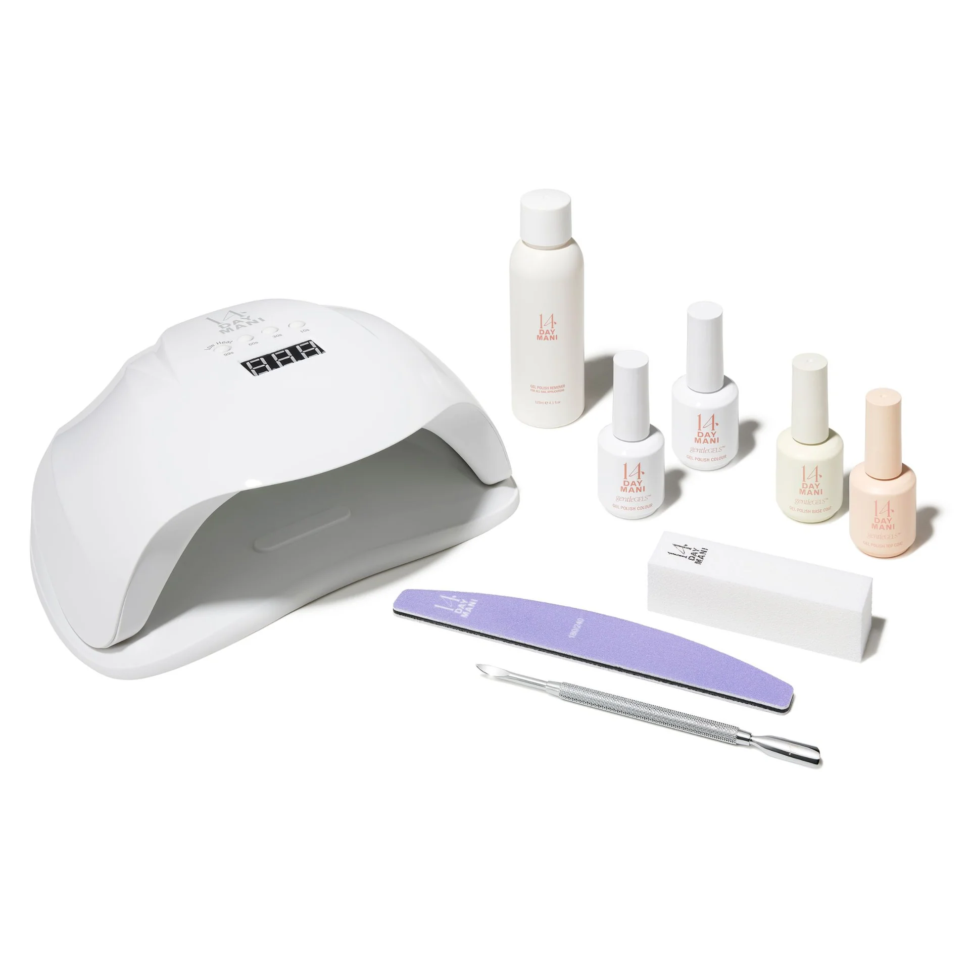 An at-home gel manicure kit with a UV lamp, bottles of polish, and various nail care tools.