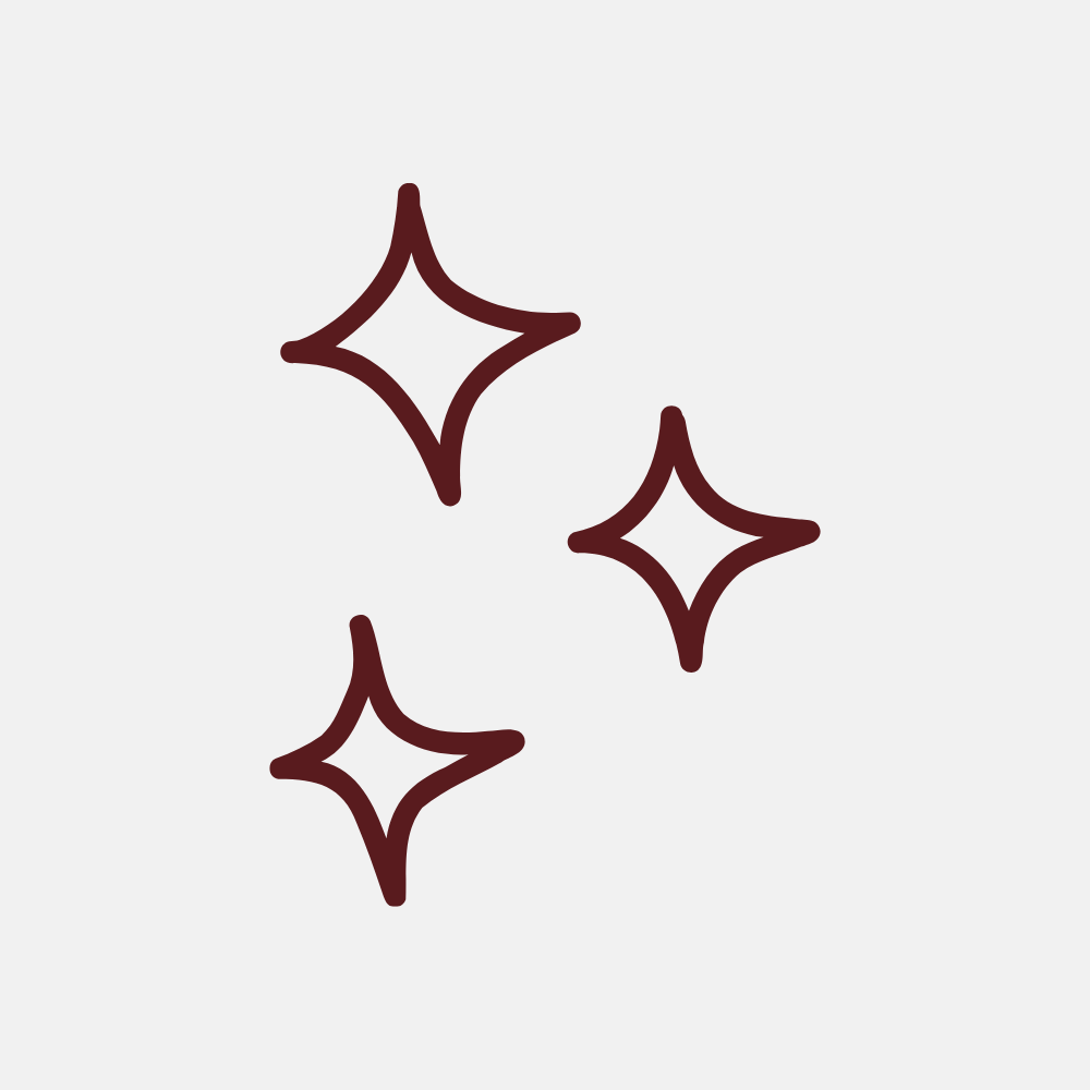 An icon of three dark red, four-pointed stars on a light gray background.
