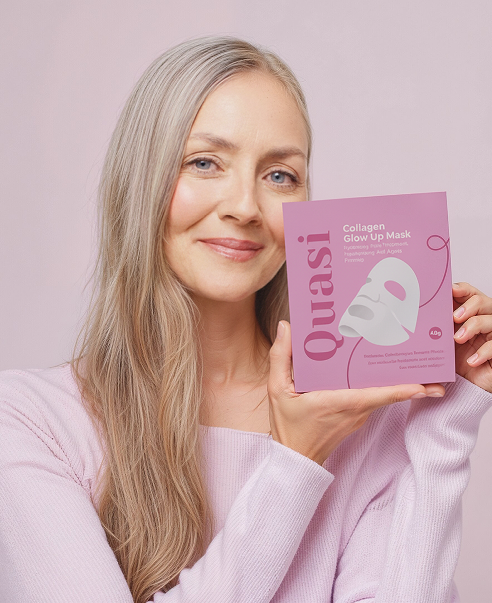 Woman holding a pink collagen glow-up mask box.