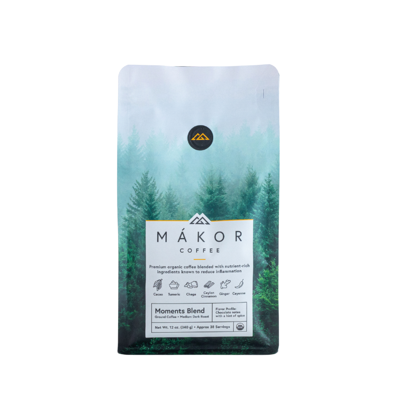 Bag of Mákor coffee against a forest backdrop.