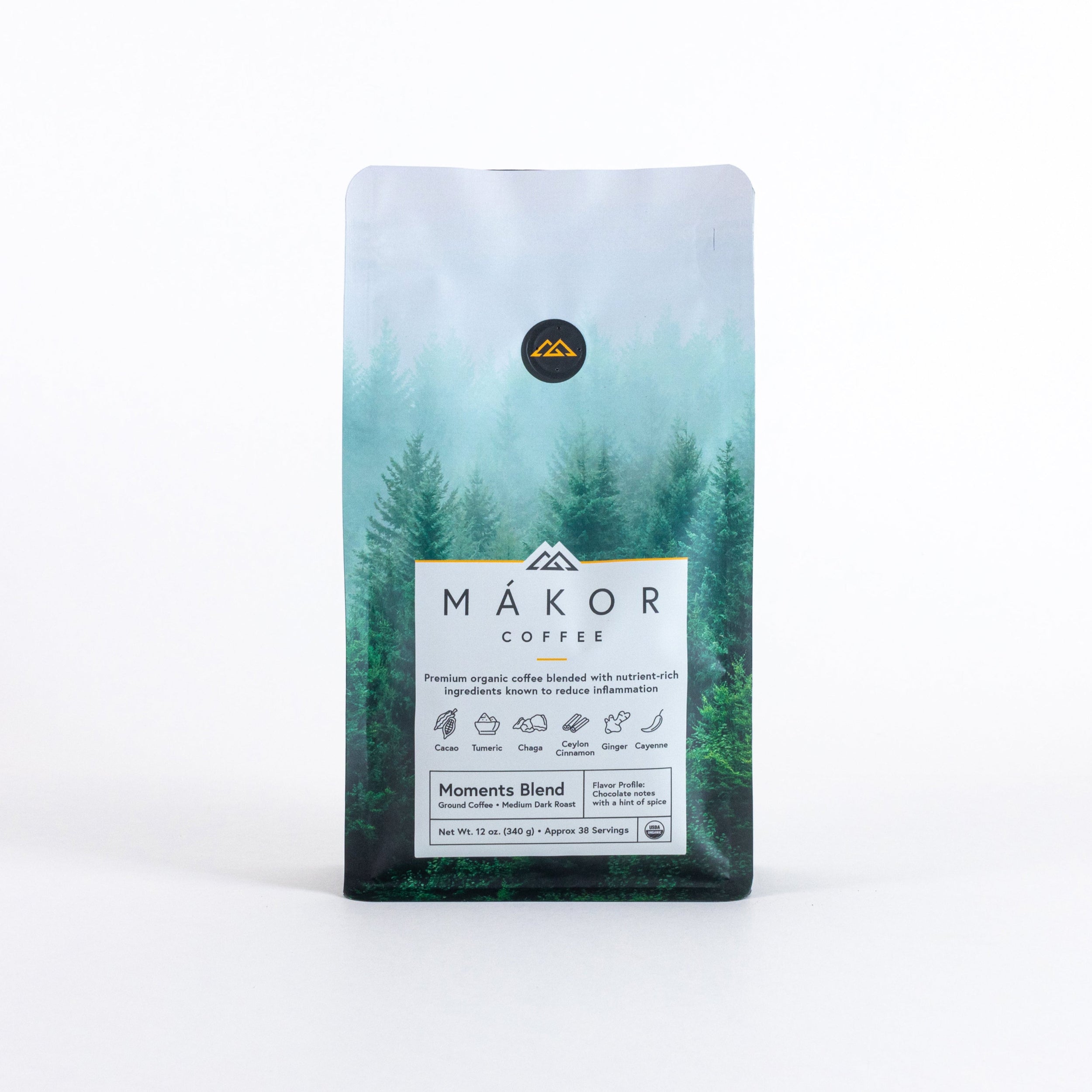 Bag of organic Mákor Coffee with forest design on packaging.
