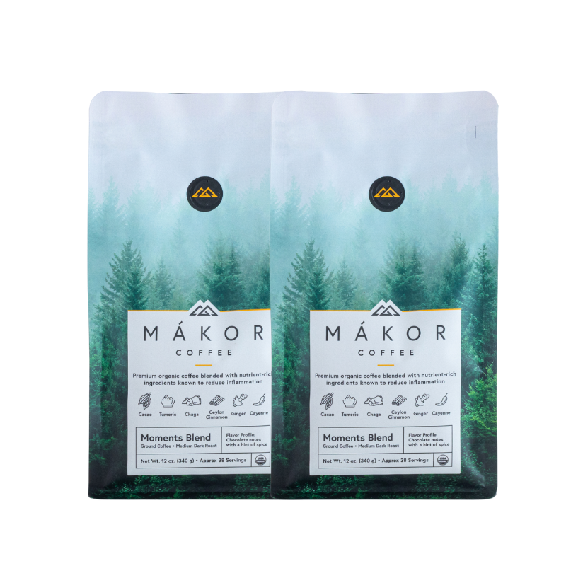 Two packages of Mákor Coffee with forest imagery on the packaging.