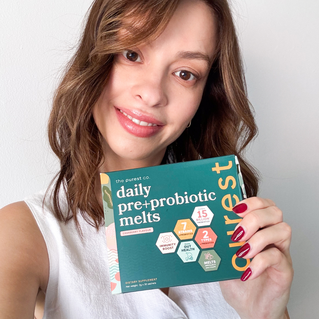Person holding a box of daily pre+probiotic melts.