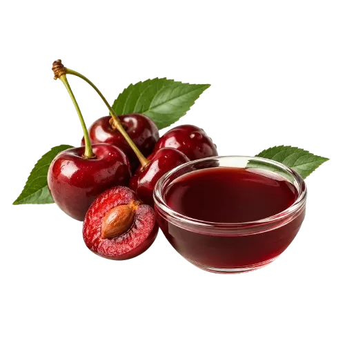 A small glass bowl of cherry juice sits beside a cluster of fresh cherries with leaves.