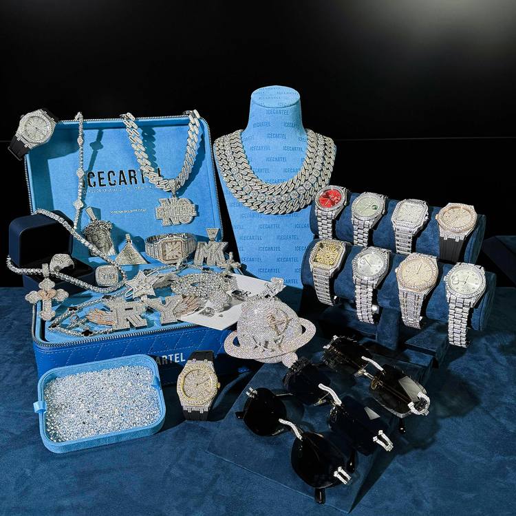 Display of luxury watches, jewelry, and sunglasses on a blue background.