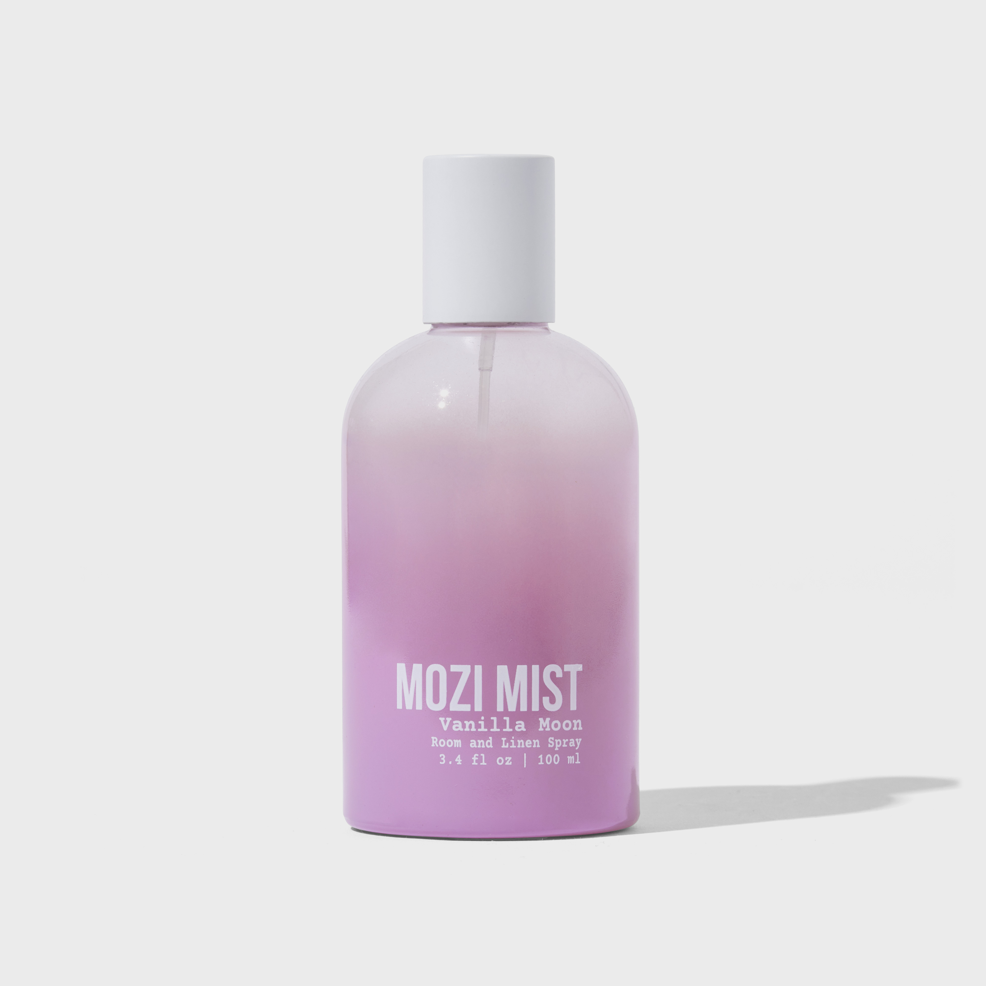 Purple gradient bottle labeled 'MOZI MIST Vanilla Moon' room and linen spray.