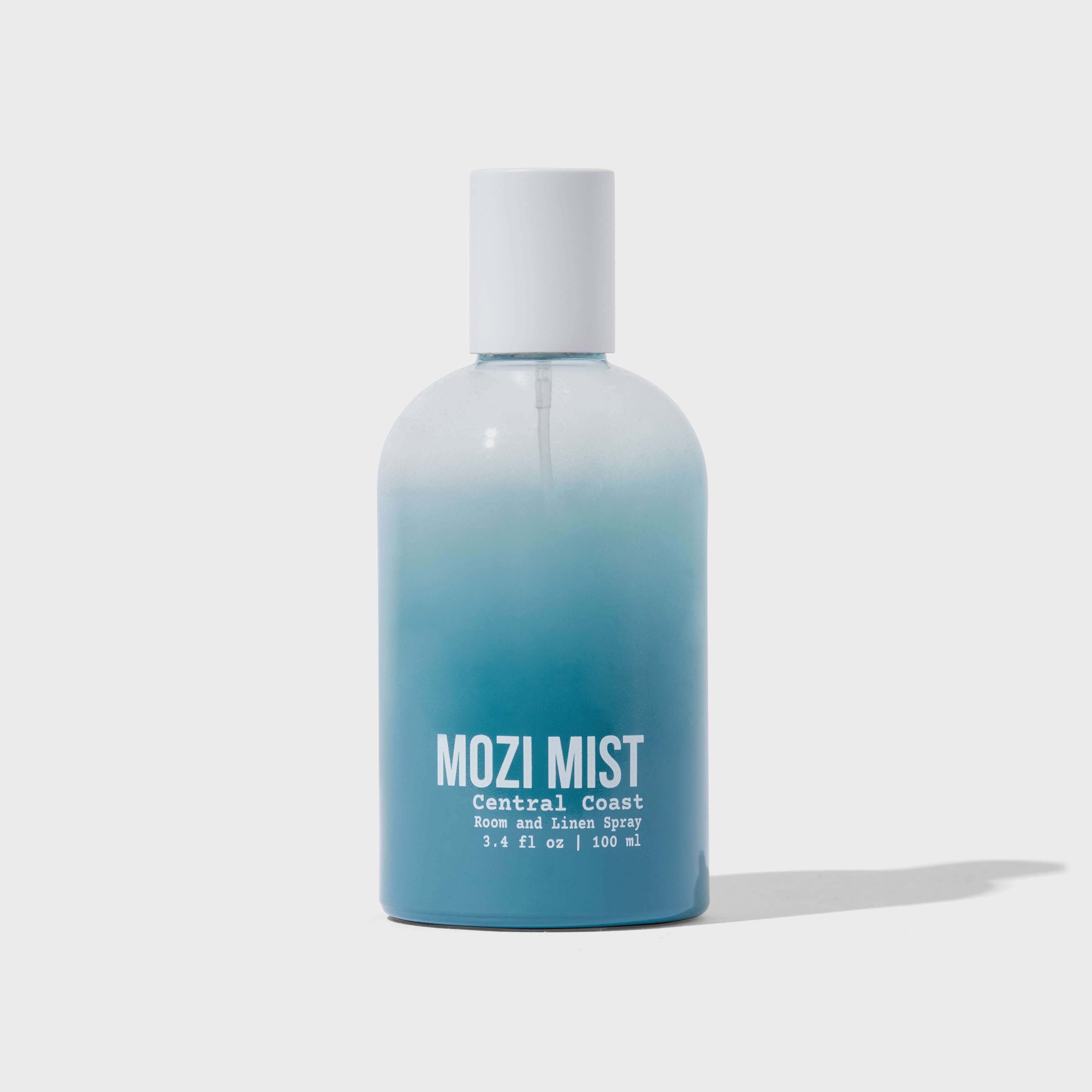 Blue gradient bottle labeled 'MOZI MIST' with white cap.