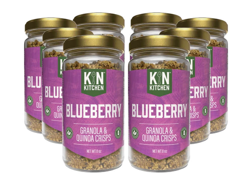 Six jars of KIN Kitchen Blueberry Granola & Quinoa Crisps against a white background.