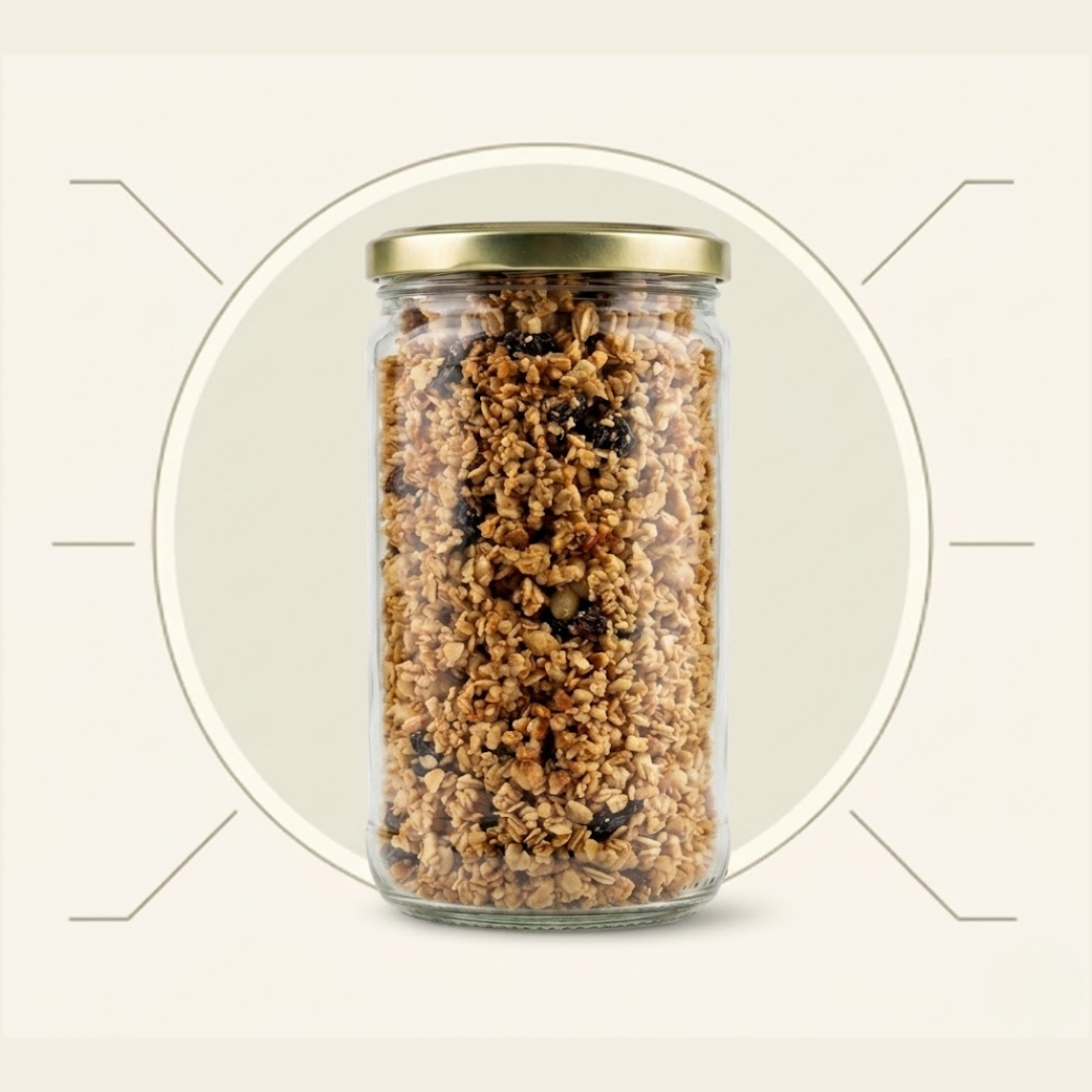 A glass jar with a gold lid, filled with granola and raisins, against a graphic background.